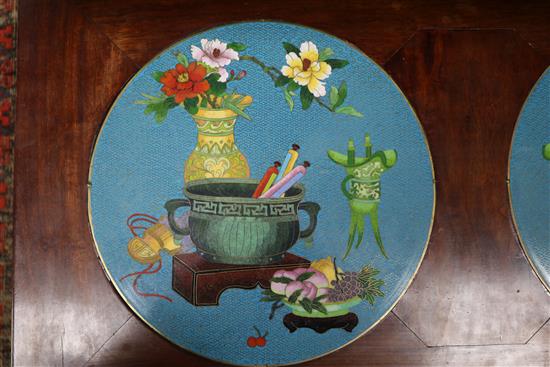 A Chinese table with two inset enamel plaques, W.82cm